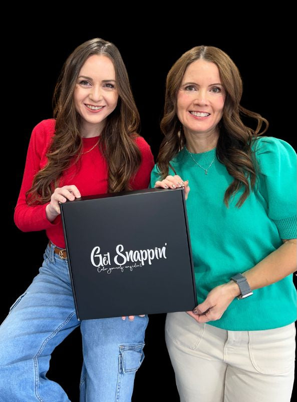 Two girls holding a Get Snappin color analysis kit